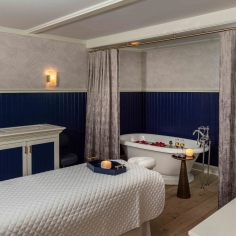 Spa treatment room roses in bathtub