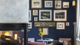 Lobby of Hotel Viking with yellow flowers and a fireplace