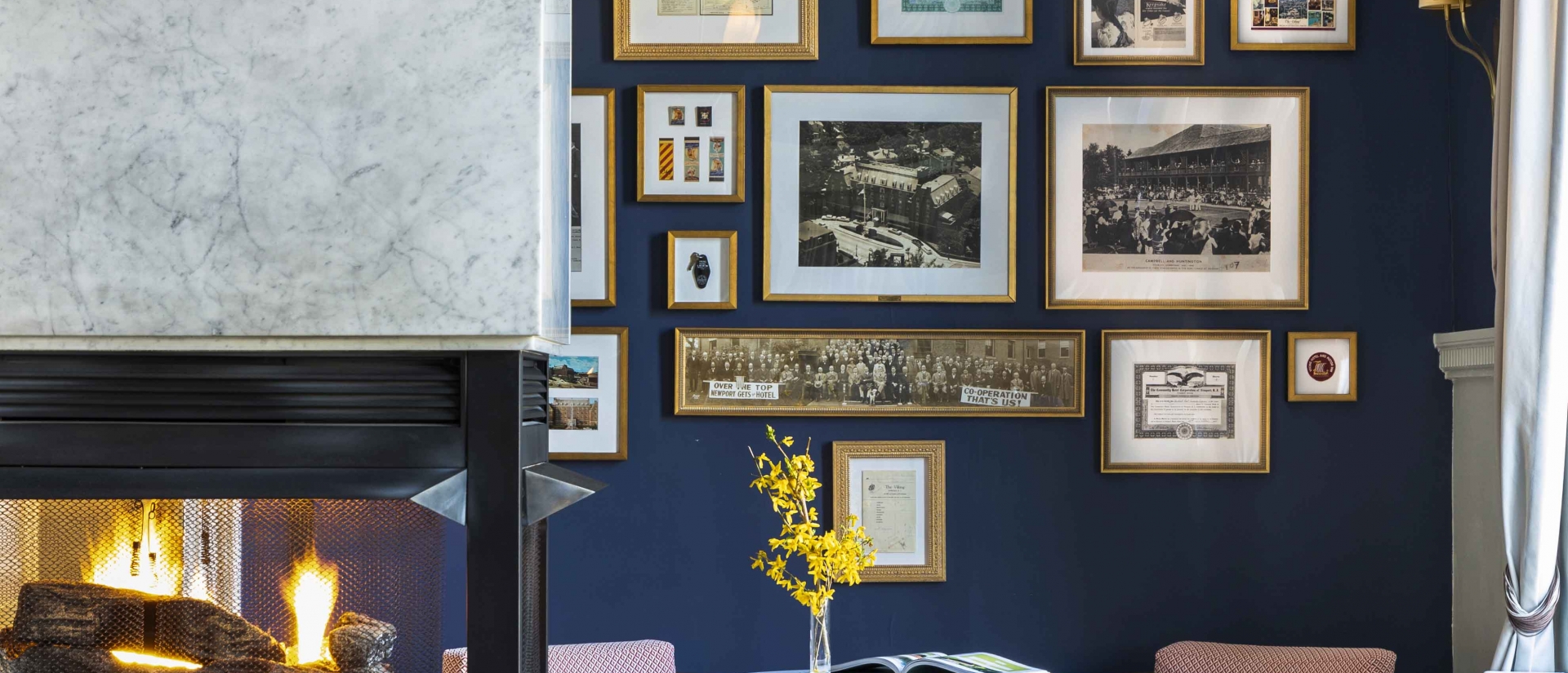 Lobby of Hotel Viking with yellow flowers and a fireplace