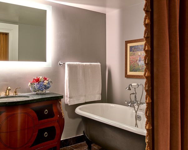 The Breakers Suite Bathroom equipped with a tub.