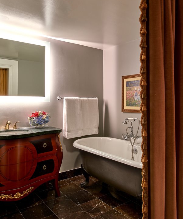 The Breakers Suite Bathroom equipped with a tub.