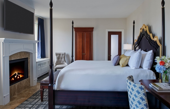 Interior view of the Estate Fireside bedroom with in-room fireplace.