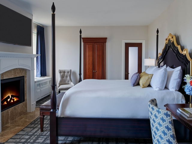 Interior view of the Estate Fireside bedroom with in-room fireplace.