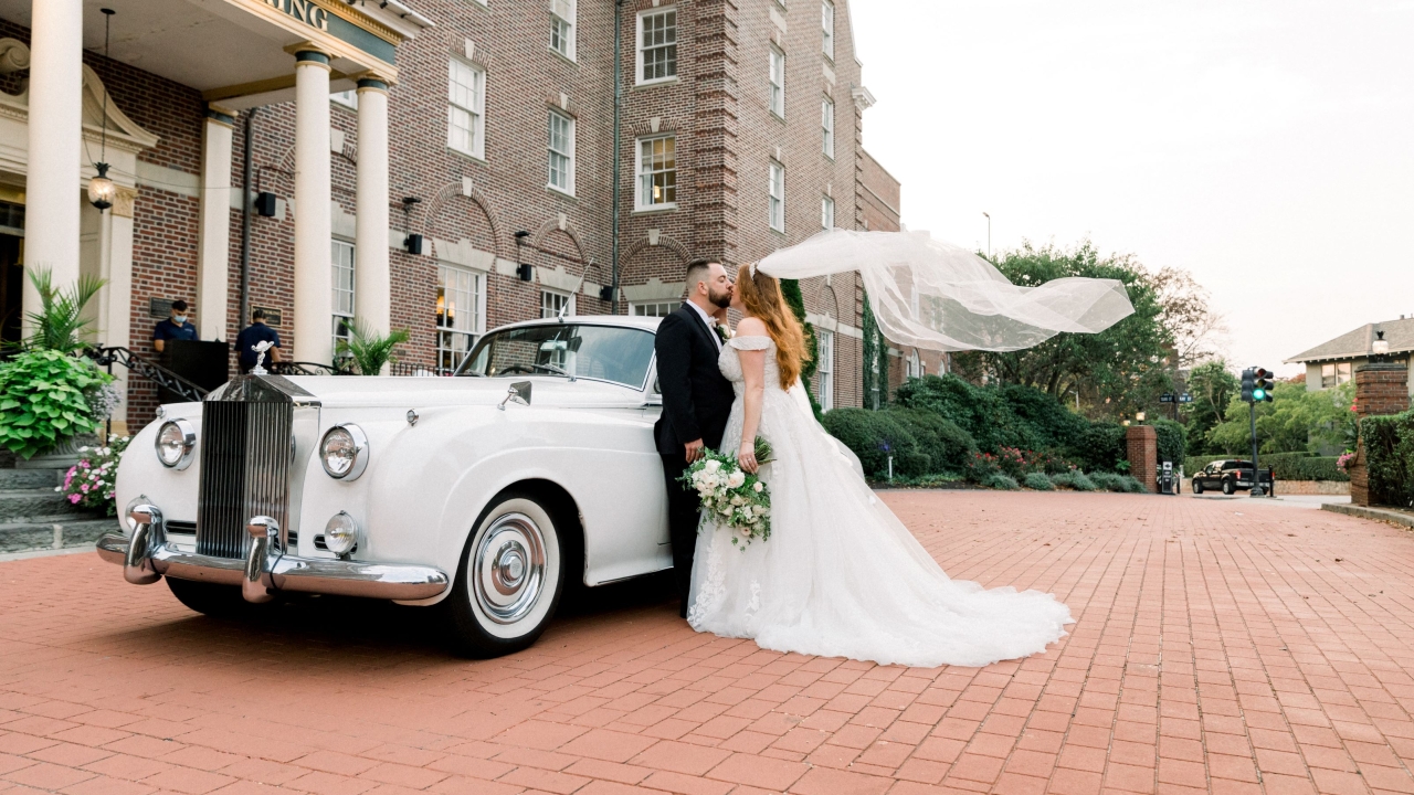 bride and groom in front of hotel viking building