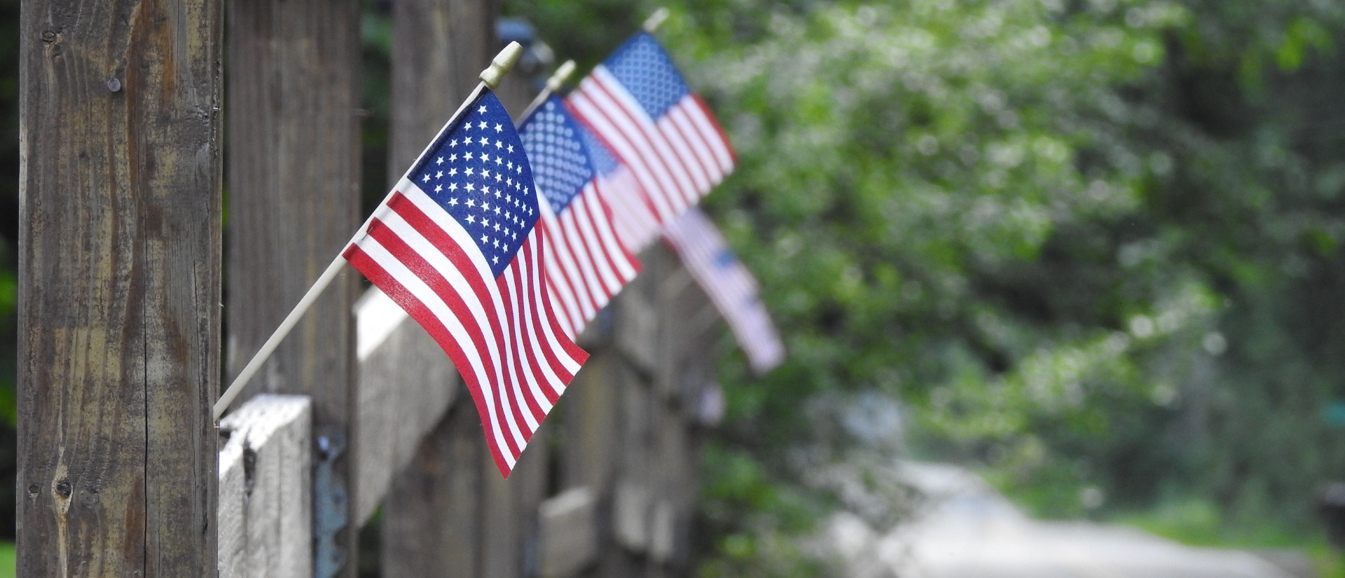 American flags on a fence