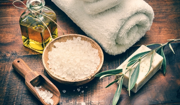 Spa salts, soap, towel and massage oil.