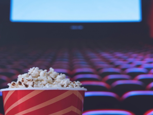 A tub of popcorn in a movie theater