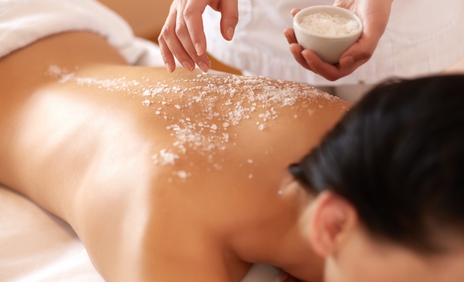 woman receiving a sugar scrub massage