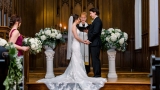 A bride and groom reading their vows to each other.