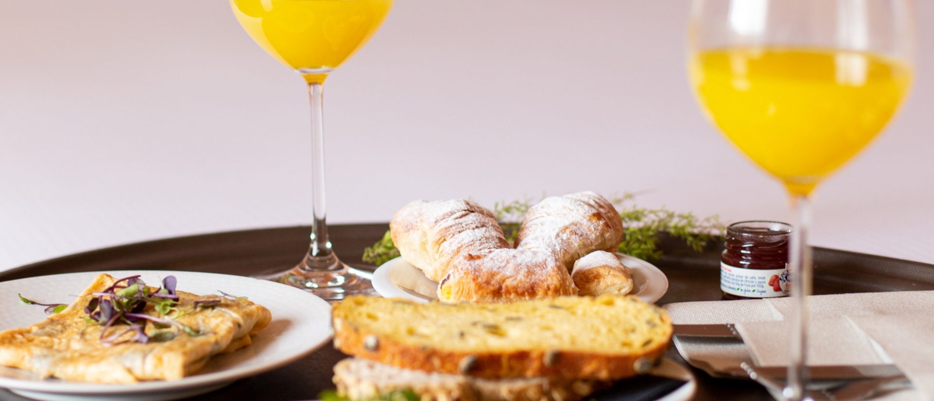 Breakfast in bed, complete with orange juice and omelettes.
