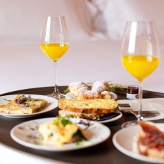 Breakfast in bed, complete with orange juice and omelettes.
