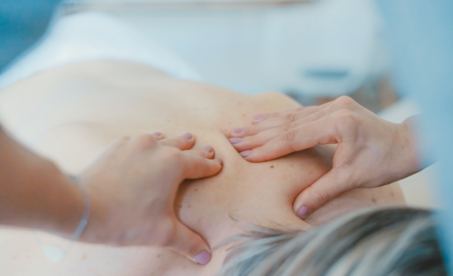 Woman receiving a back massage.