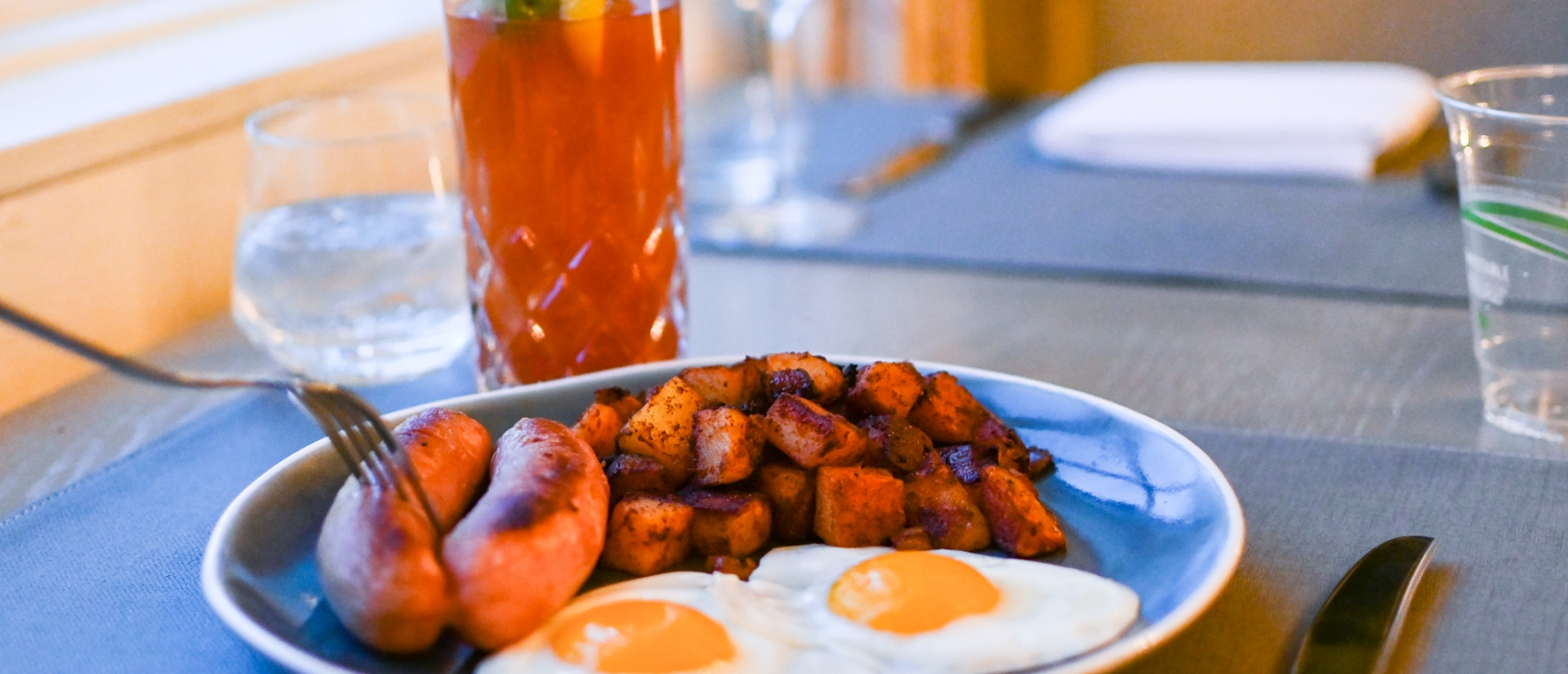 eggs, sausage, and hash brown breakfast