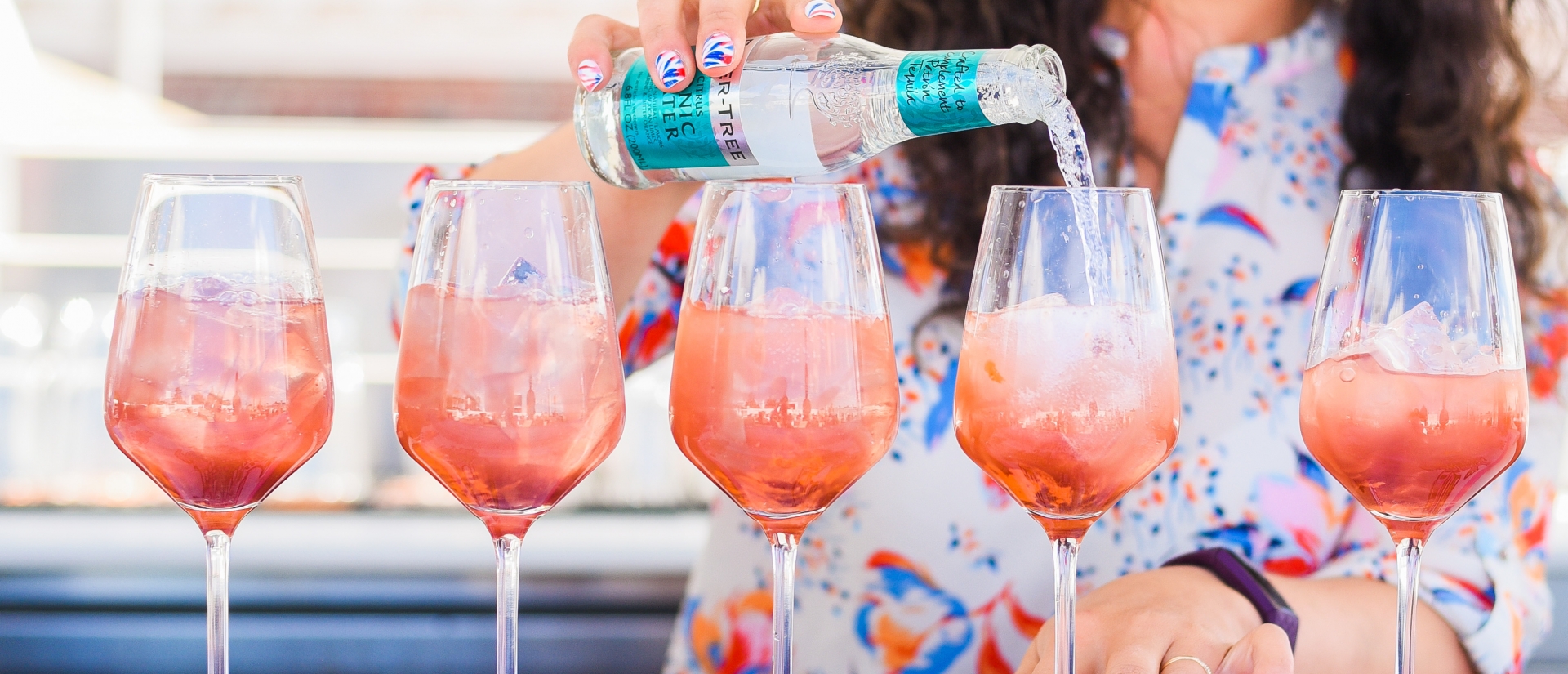 women holding cocktail at the Lobby Bar