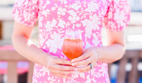 women holding cocktail at the Lobby Bar
