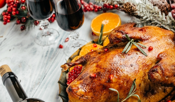 Baked Christmas duck with rosemary, berry and orange
